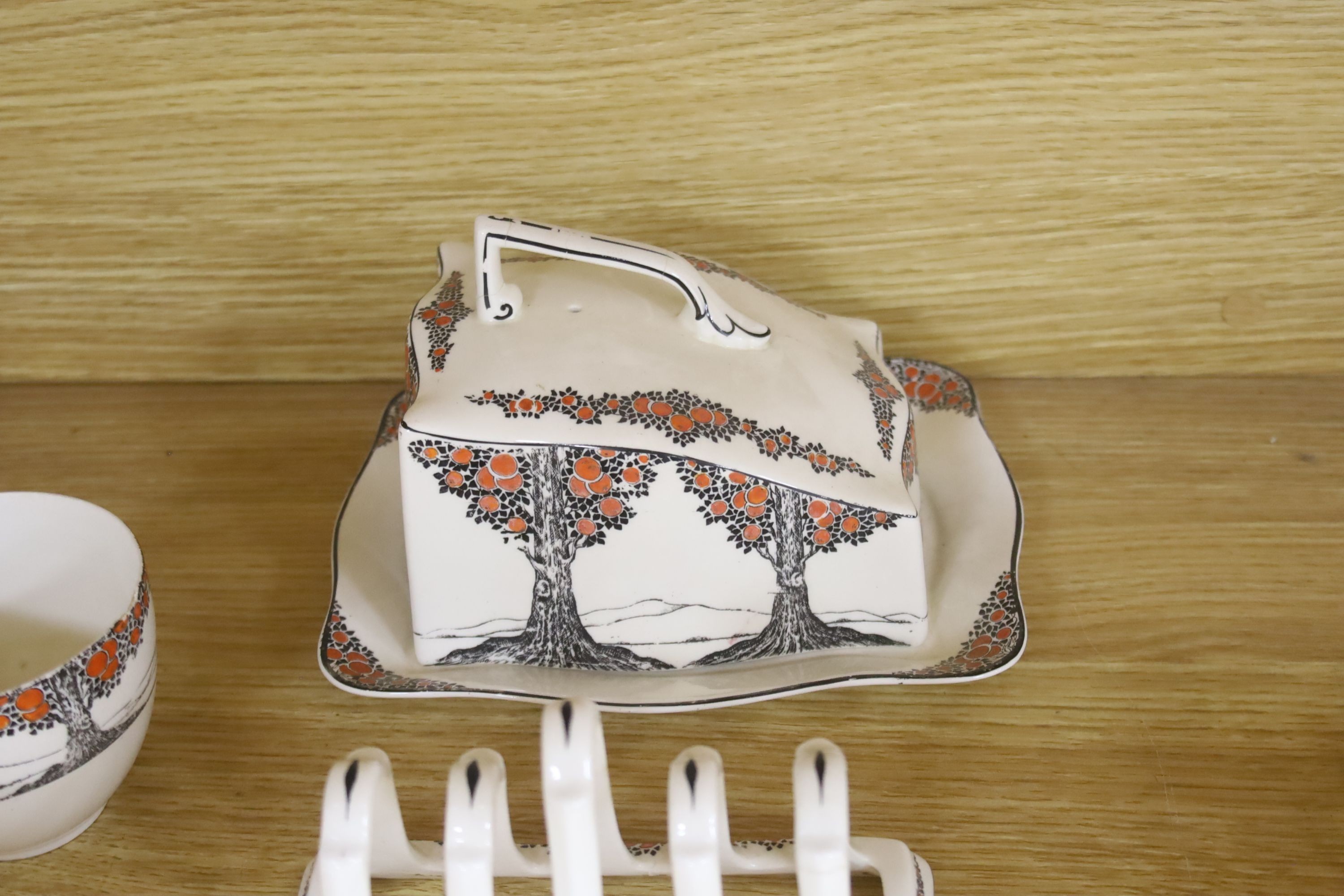 A Crown Ducal Art Deco 'Orange Tree' breakfast, tea and coffee service, to include a biscuit barrel, cheese dish and toast rack